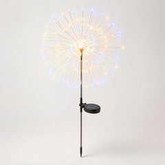 Dandelion Firework Garden Light — airy dandelion-shaped garden light with radiating wires glowing among planters and patio pots