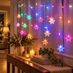 Snowdrift LED Snowflake Curtain Lights — in situ at night