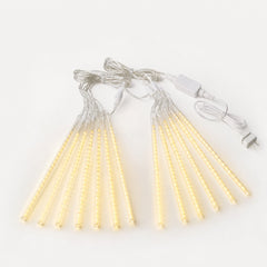 LumaFall Meteor Lights — slim vertical tube meteor lights cascading warm light along a roofline