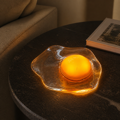 Yolk Glow Accent Light creating a warm mood on a dark stone table