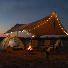 Celeste solar string lights glowing at campsite at dusk