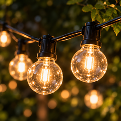 Celeste Plug-In globe lights close-up showing clear globes, black sockets and cable