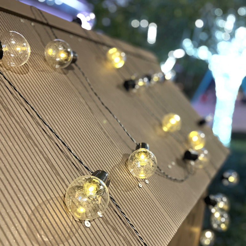 Clear globe string lights under a canopy; collection inspiration