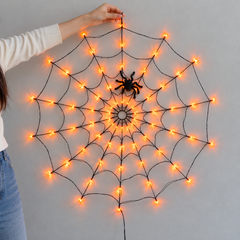 Cobweb Glow LED Halloween Net Lights — in situ at night