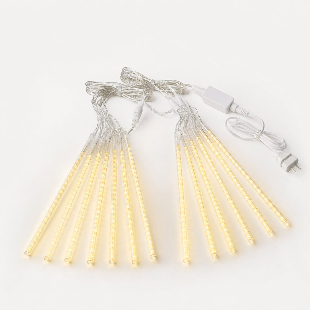 LumaFall LED Meteor Lights — slim vertical tube meteor lights cascading warm light along a roofline